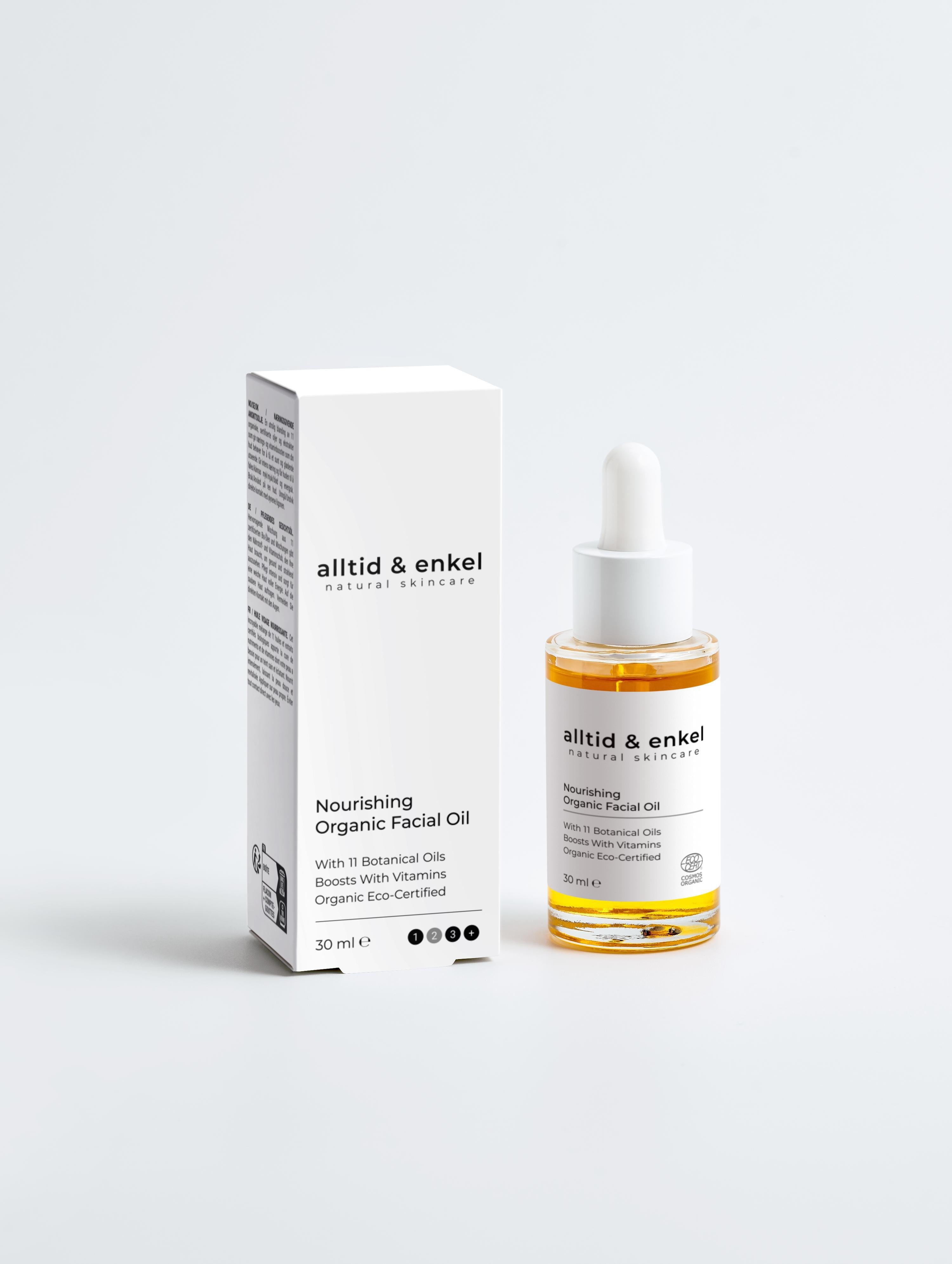 Nourishing organic facial oil in a sleek white bottle with box on a white background, 30 ml.